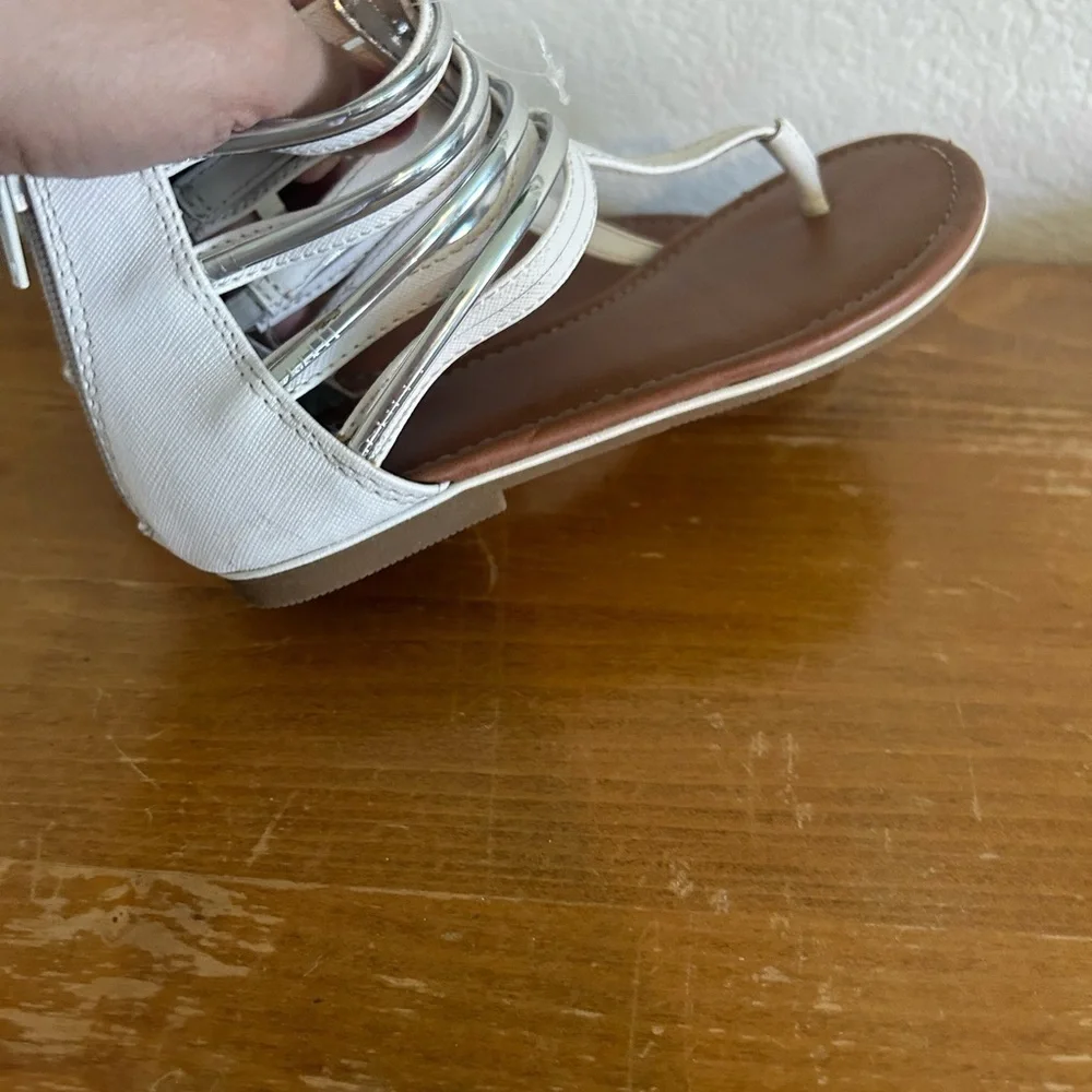 Youth size, one justice, gladiator, white, and silver sandals